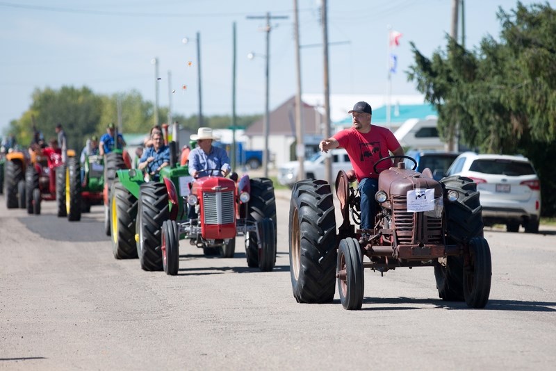 Martin Amyotte drives one of many antique tractors that made up a parade in Mallaig on Aug. 26.