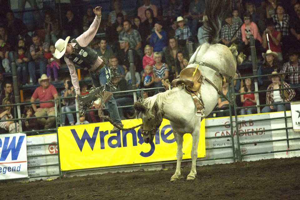 Nicholas Patterson of Blackfalds, Alta., gets thrown from a horse during the saddle bronc event on Thursday night during the first performance of the LRA finals. See next