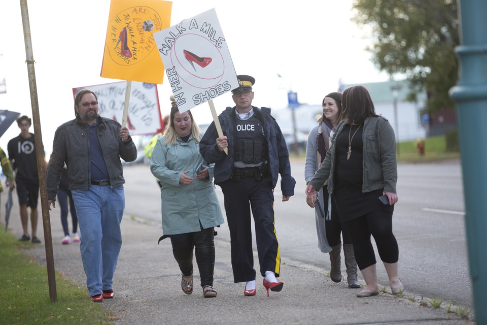 The first annual Walk a Mile in her Shoes event saw men walk a mile in women&#8217;s high heels, in support of the local women&#8217;s shelter expansion. See this
