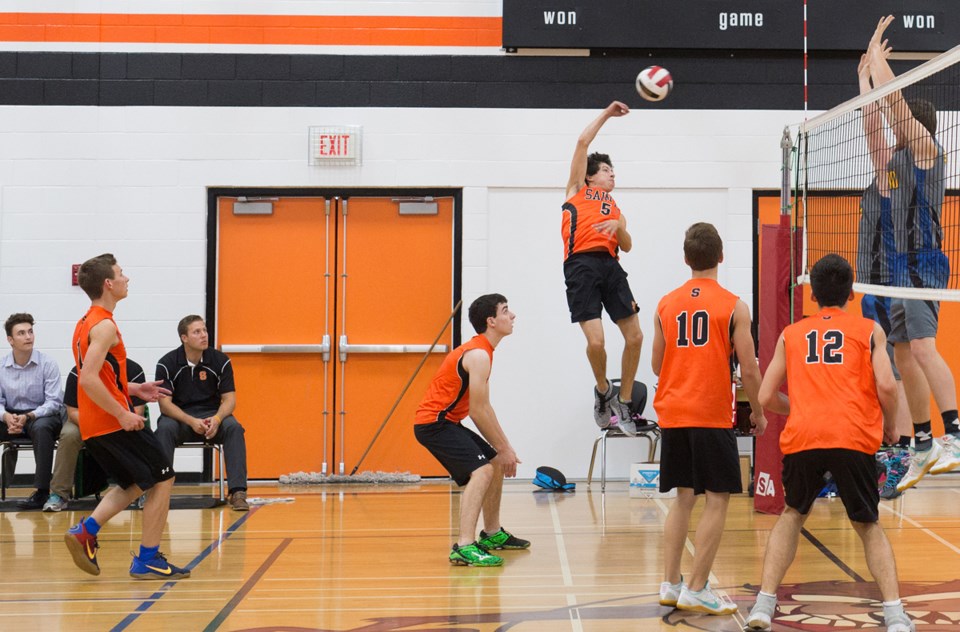 Brendan Levasseur blasts the volleyball over the net during the Saints&#8217; Tazmania volleyball tournament, held this past weekend in St. Paul. The Regional boys&#8217; and 