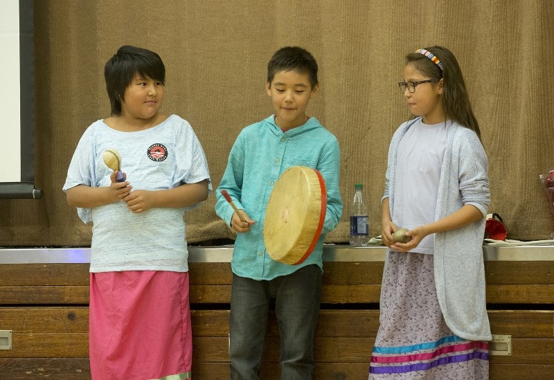 Linda Cardinal, Stanley Cardinal and Alicia Steinhauer sing a traditional song during a talk about Orange Shirt Day at Ashmont Elementary, Sept. 28.