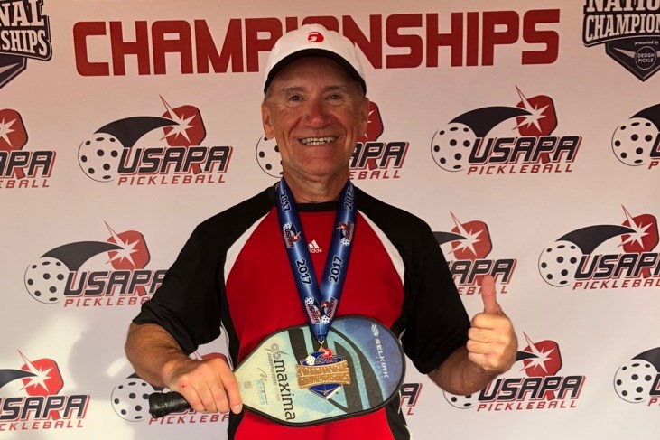Norm Kowalchuk shows off his gold medal from the USAPA National Championships.