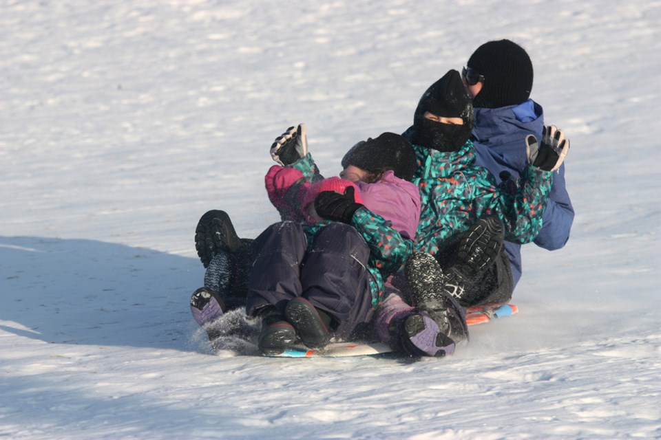 Children enjoyed the warmer weather last week, playing outside in the snow, before heading back to class on Jan. 8.