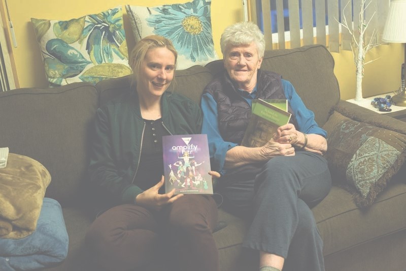 Nicole Sorochan (left) and Ella Drobot hold their creative works in their hands. Sorochan is a filmmaker based out of B.C., while her grandmother, Drobot, is a St. Paul