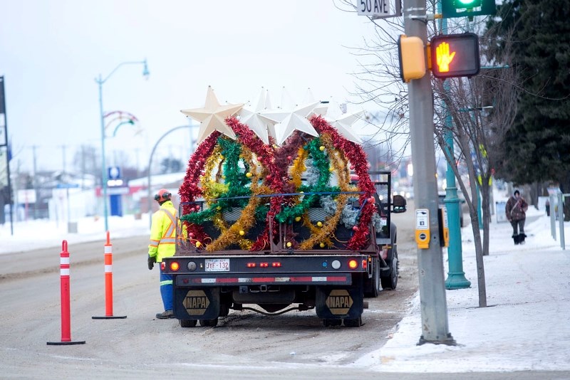 The Town of St. Paul has purchased new Christmas lights, which will be hung on the light standards in town next holiday season. Pictured are the old lights as they are being