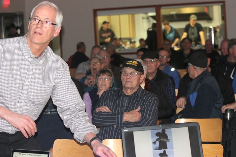 Paul MacMahon goes through slides presenting the proposed changes to the public regarding fishing regulations.