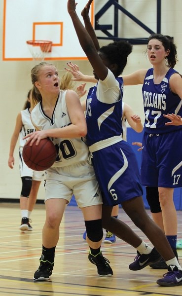 iana Davidson-Sykes found herself blocked by an opposing Westwood Community High School player during the North East 3A Zone Championship on March 10 at Aurora Middle School. 