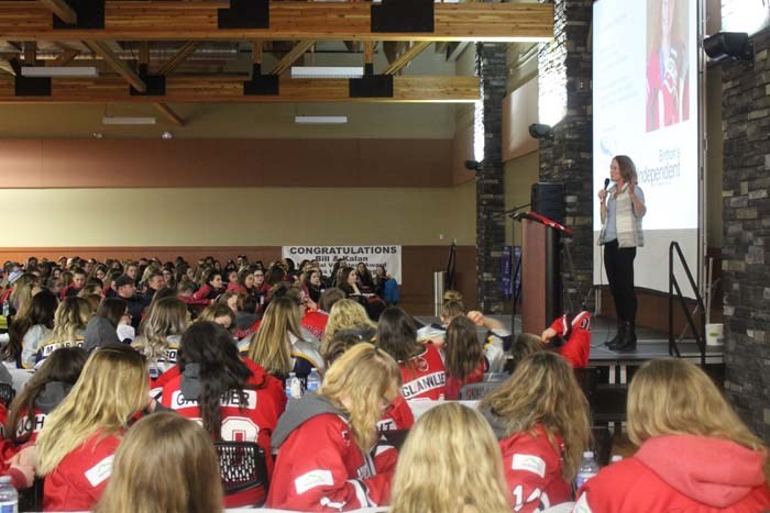 Heaney speaks to female midget-age hockey players in Lac La Biche