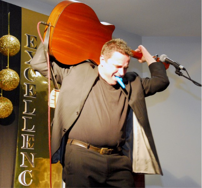 Comedian Todd Butler was a musical contortionist at times, but spent the majority of his set strumming the guitar normally to self-crafted songs featuring lists of Alberta