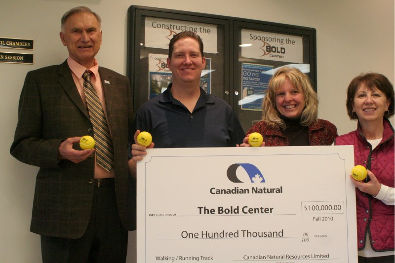 Mayor Peter Kirylchuk, Todd Andrews from Canadian Natural Resources Limited, Bold Center Fundraising Coordinator Jane Palmer and Barbara Camponi from CNRL hold up the