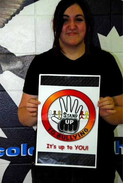 Ecole Plamondon Grade 11 student Danika Sehn shows her winning anti-bullying poster design.