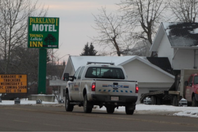 RCMP kept a close watch around the Parkland Motel where the first getaway vehicle from Tuesday&#8217;s bank robbery was found. Police say they know who the robbers are.