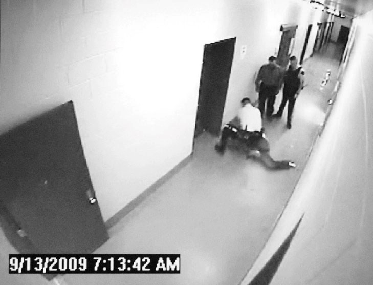 Suspended LLB Mountie Desmond Sandboe is seen in this RCMP video attacking a prisoner at the detachment.