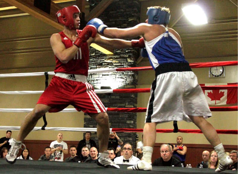 Lac La Biche boxer Pierre Berube (left) blocks a punch from Blueridge&#8217;s Randy Thompson during last Saturday&#8217;s boxing match at the Bold Center. Three hundred