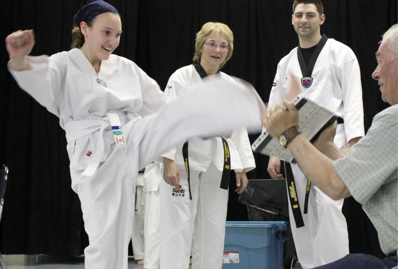 Northern Lights Taekwondo Club student Shanelle Gauthier kicks the board at last Wednesday&#8217;s Break for Hope fundraiser that raised $5,660 for Hope Haven Women&#8217;s