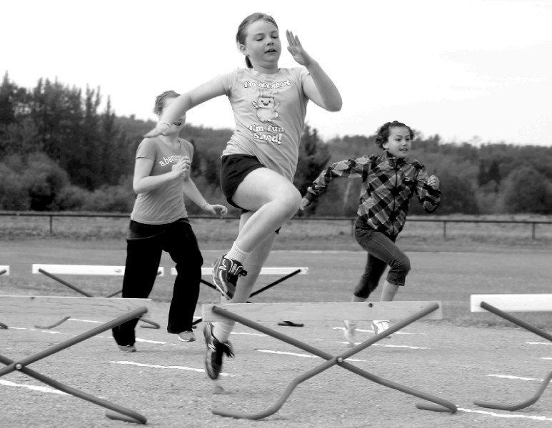 Students compete in the hurdles category.