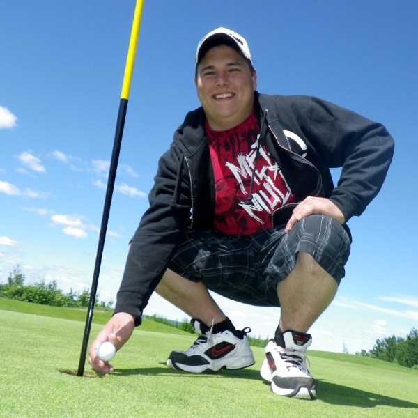 Greg Zevola was all smiles after getting a hole in one at the Canada Day golf tournament. His $2,500 prize is a gift certificate to Marczak&#8217;s True Value hardware store. 