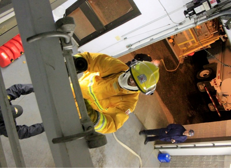 A new member of the Hylo Fire Department is put through his paces in a training exercise in the hamlet&#8217;s fire hall.