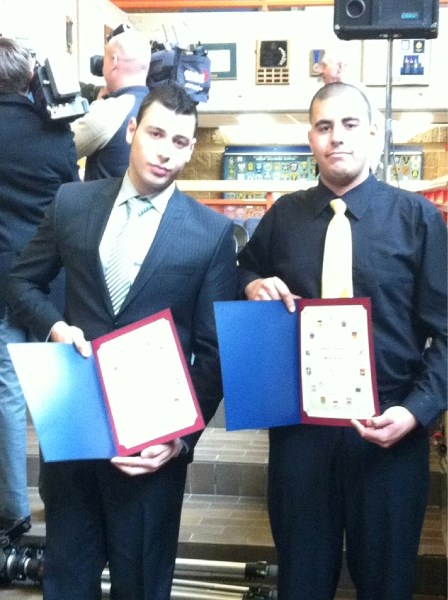 Ahmed (left) and Walied Fayad pose with their bravery awards in Edmonton Nov. 14.
