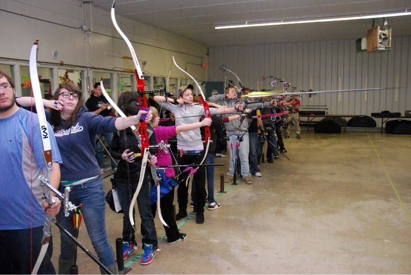 Young archers take aim at targets during tryouts to place first in their individual category and make the team for Alberta Witer Games.