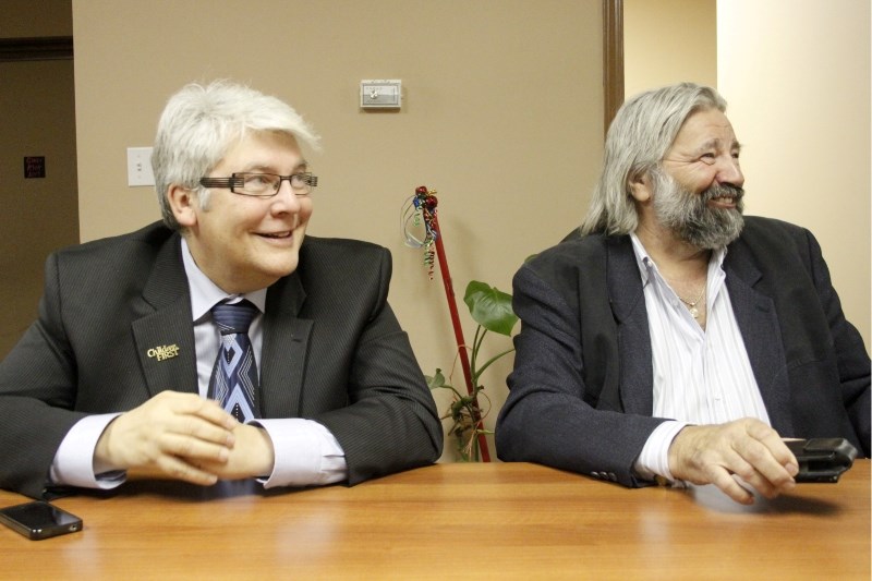 Minister of Human Services Dave Hancock (left) and Minister of Transportation Ray Danyluk at the Lac La Biche Post office Jan. 25 during a day-long visit in the community.