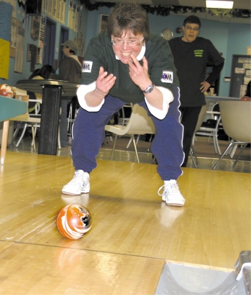 STRIKE! An excited Sonya King bowls to represent the Lac La Biche Disability Services at the Big Brothers Big Sisters Bowl for Kids Sake charity event on March 10.