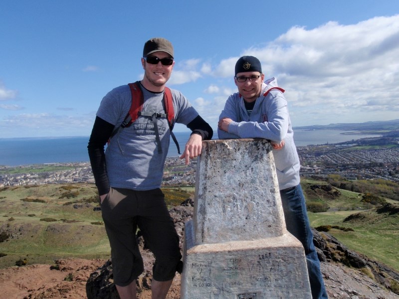 Chad Winger (left) and Daniel Booth at Arthur&#8217;s Seat, a hill overlooking Ediburgh Scotland. The two musicians and world-travellers will be playing a St. Patrick&#8217;s 