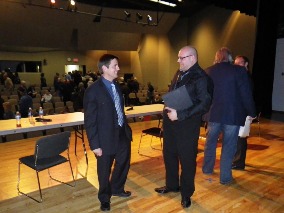 John Nowak and Shayne Saskiw share a laugh after Tuesday&#8217;s forum, as Ray Danyluk and Phil Johnson also discuss local and provincial happenings.