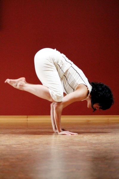 Local yoga instructor Serena Arora, pictured here doing a crow pose at her studio, is wrapping up yoga classes at the beginning of May.