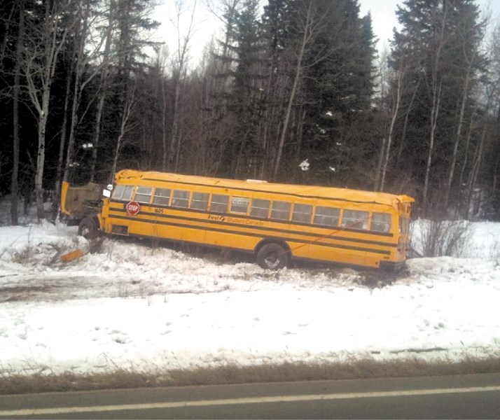 A smashed-up school bus lies in the ditch after it rolled when the driver swerved to avoid a deer last Tuesday. Thankfully, no children were on the bus and the driver
