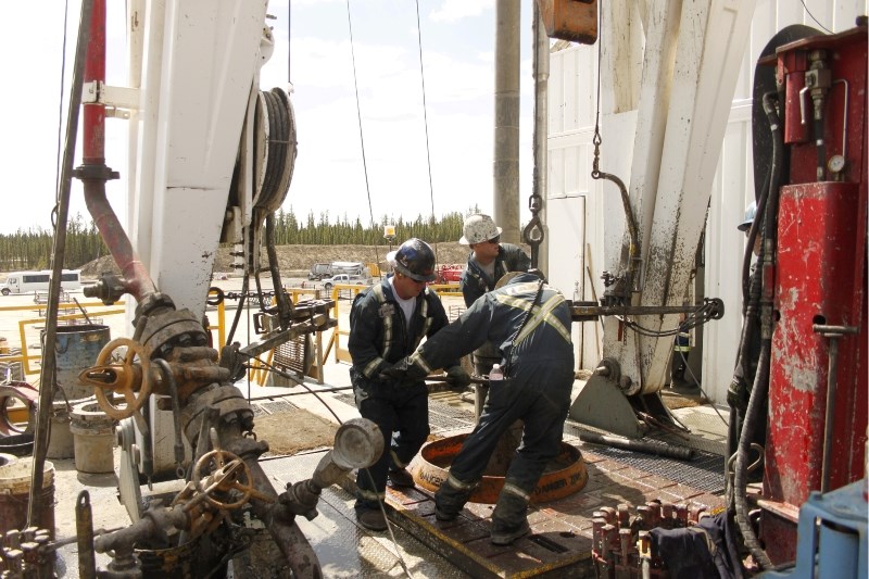 A team of &#8220;roughnecks&#8221; work on a mobile drilling rig at Cenovus Energy&#8217;s Christina Lake site last Wednesday.