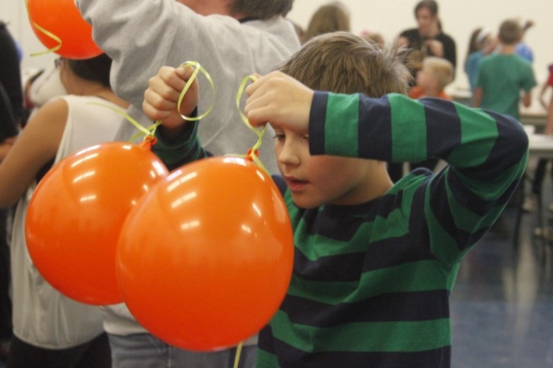 Dr. Swift Grade 6 student Andrew Rubik takes part in a massive science experiment that included 120 of his classmates. The young scientists attempted to set a record in the