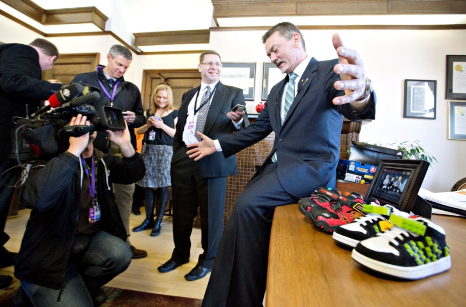 Alberta Finance boss Doug Horner and his grandkids&#8217; new budget shoes &#8230; that he put on the table.