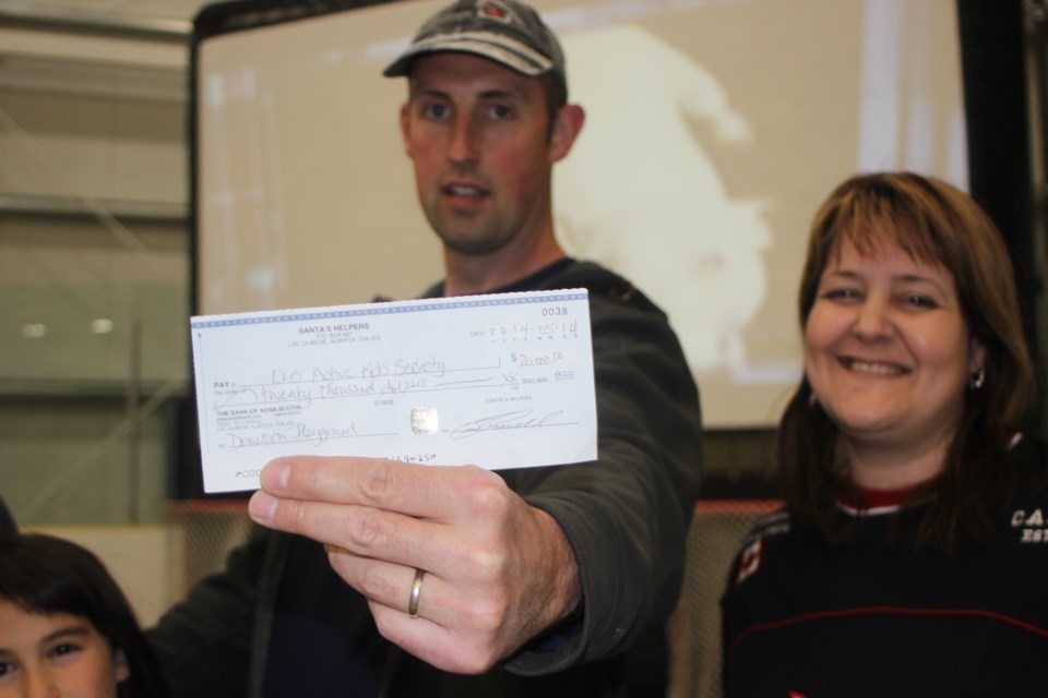 The LLB Firefighter&#8217;s Society&#8217;s Chris Newhook, with the Active Kids Society&#8217;s Lucie Theroux, presented the society a $20,000 cheque May 29 to aid their