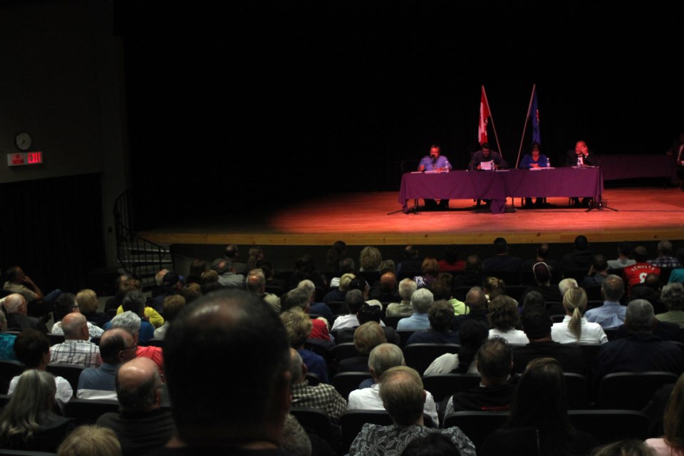 Mayoral candidates Robert Richard, Omer Moghrabi, Phylis Gauthier and Alex Broadbent field questions from a packed McGrane Theatre at Portage College.
