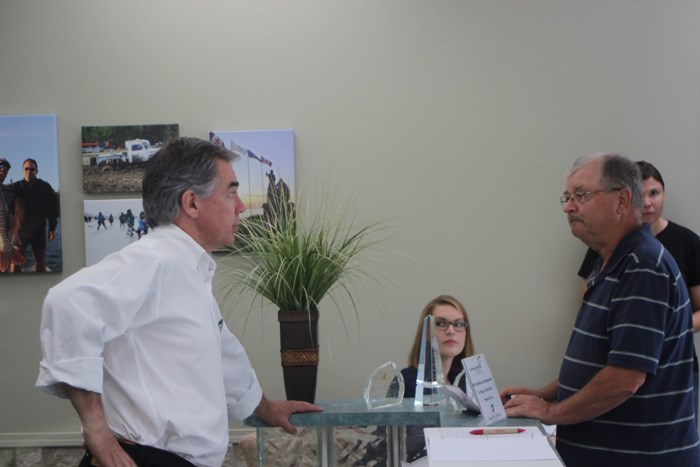 Jim Prentice chats with Eugene Uganecz at a Lac La Biche Chamber of Commerce meet-and-greet Aug. 1.