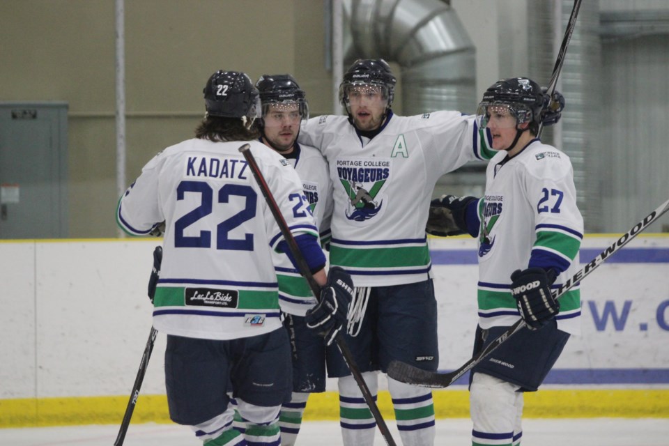 The Voyageurs celebrate a second-period powerplay goal by Jordan Geddes that gave them the lead during Saturday night&#8217;s game against the Grant MacEwan Griffins. The
