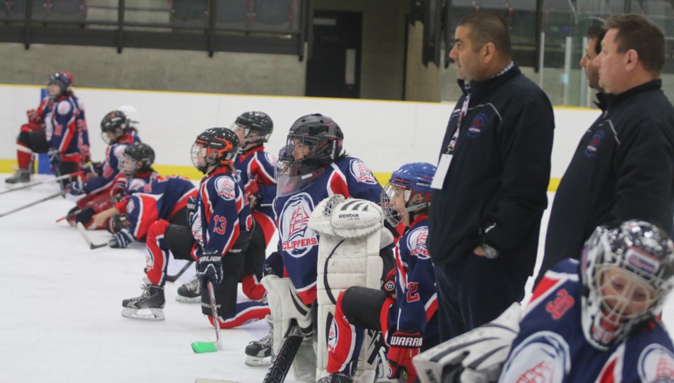 The Lac La Biche Peewee A Clippers take a knee on the blue line after being eliminated from the provincial championships by Okotoks at the Bold Center on Saturday.