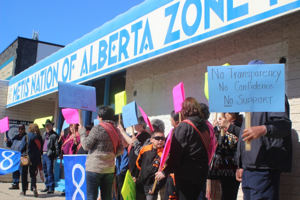 Protesters gather outside of the Métis Nation office on Thursday