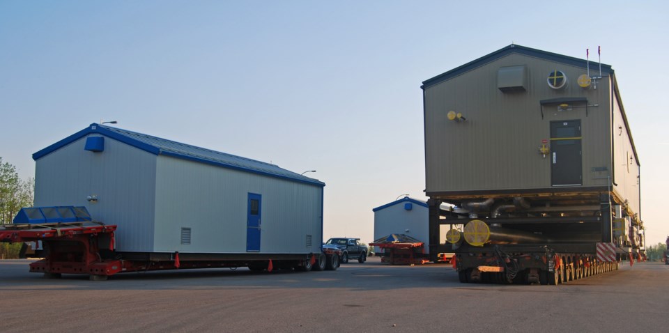 Oversized loads parked for the night beside Highway 881 near Lac La Biche.