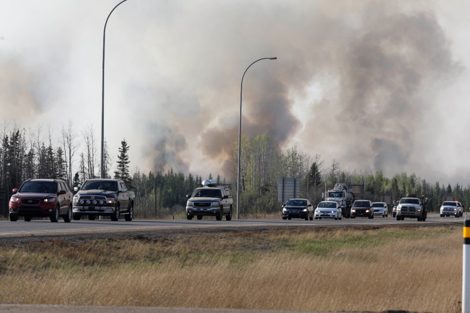 A convoy of vehicles travels south down Highway 63, away from Fort McMurray. Evacuees who had to go north to leave the city were allowed to go south when it was safe to pass