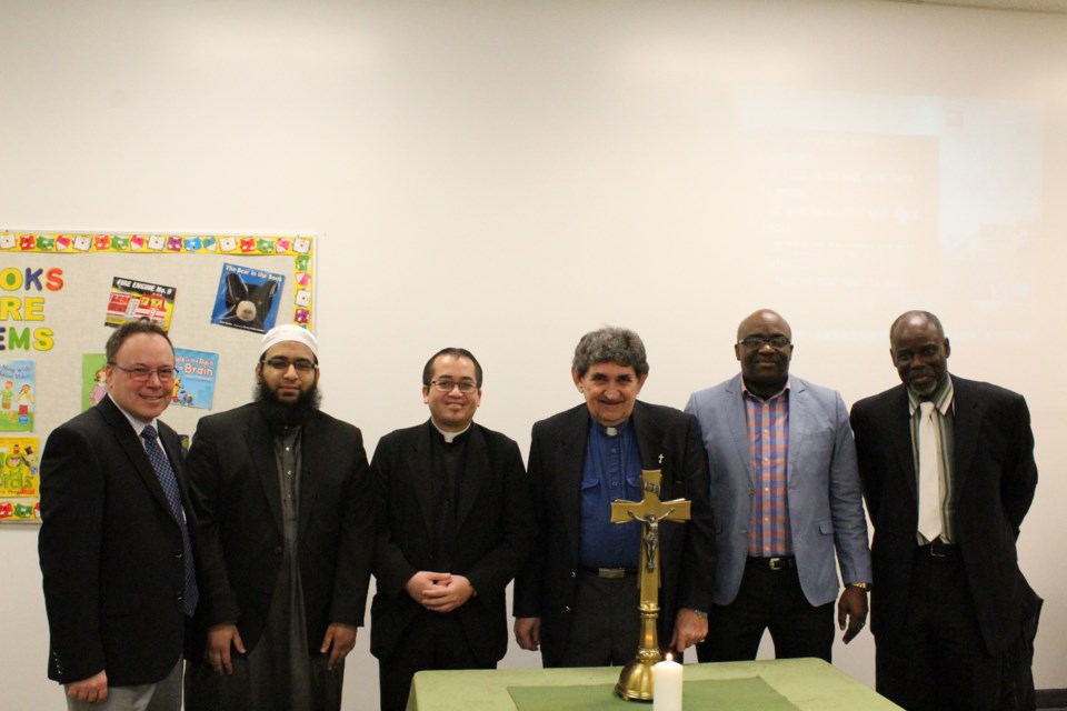 A diverse group of clergymen From right to left are Pastor Seyi Etim of Grassland Full Gospel Church, Pastor Emmanuel Chiwele of the Evangelical Free Church, Deacon Ernie