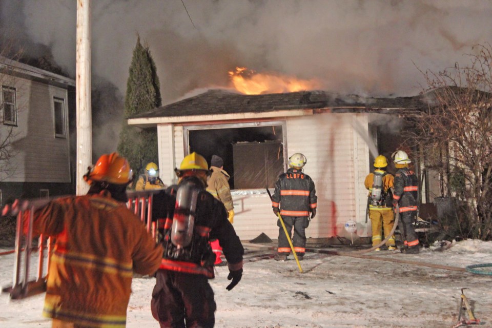Lac La Biche County fire crews attend a Feb. 5 blaze at a home on 102 Ave. Police believe the fire may have suspicious origins.
