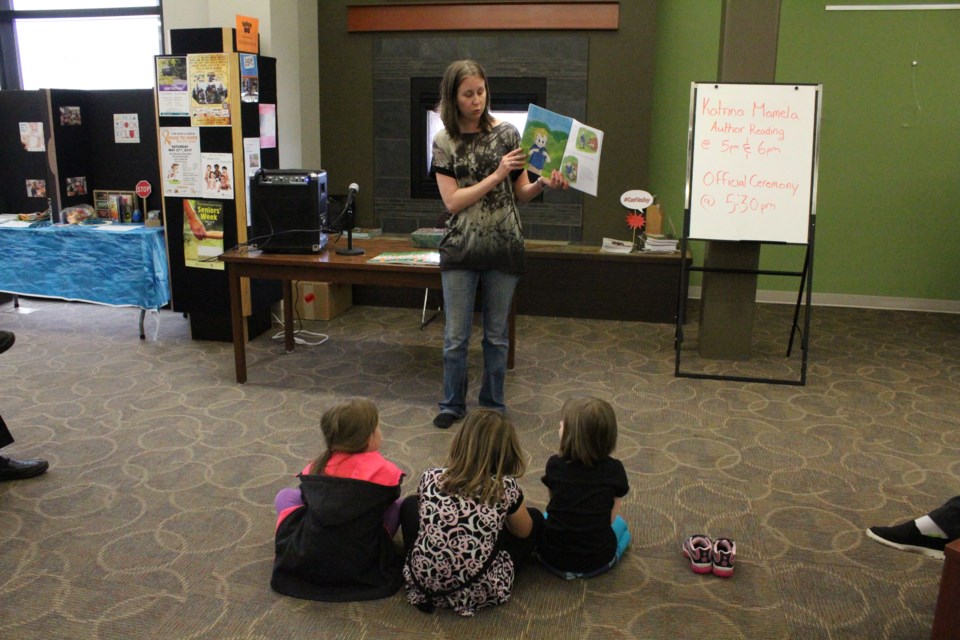 Katrina Mamela reads Got Your Nose! during her book launch at the Stuart McPherson Library last Tuesday.