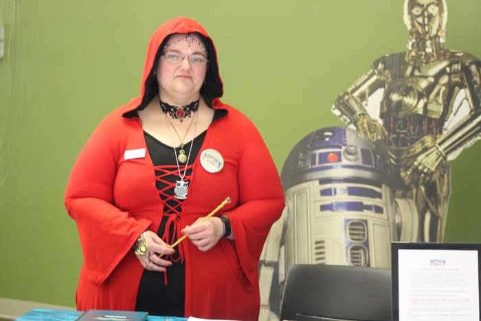  Circulation Clerk Vanessa Arfmann dressed as a Sorceress was in-charge of the costume contest. Winners will be announced next week