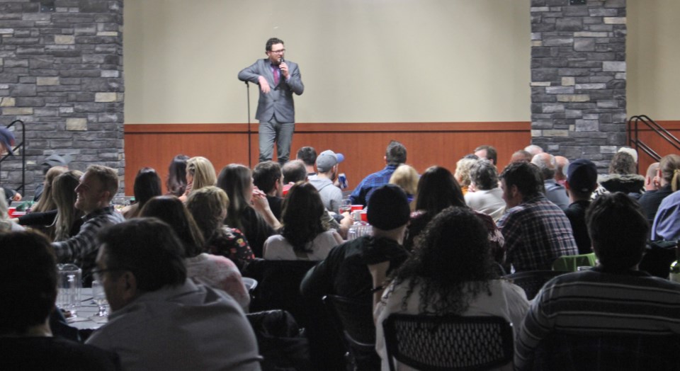  Comedian Todd Ness with the crowd at last year's gymnastics club's comedy fundraiser.