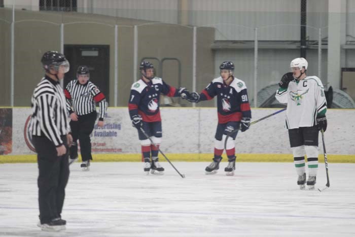  Isaac Bar and Dawson Boucher   pound fists after one of their  goals against the Frog Lake T-Birds