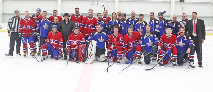  Post-game group shot of both teams, their coaches and the refs