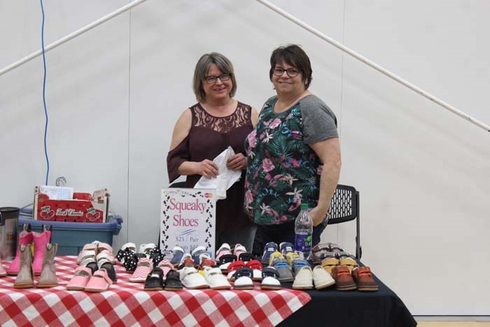  Organizer Bev Tkachuk with Tina Subchuk at her stall