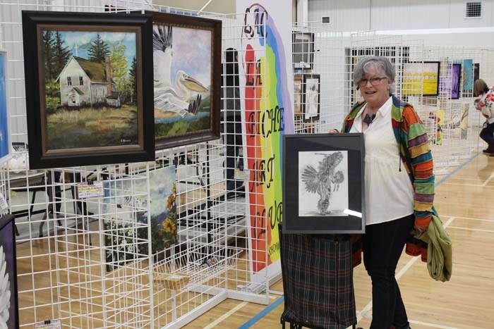  Sandy Makokis with the Lac La Biche Art Club displays her artwork at the Easter Sale event
